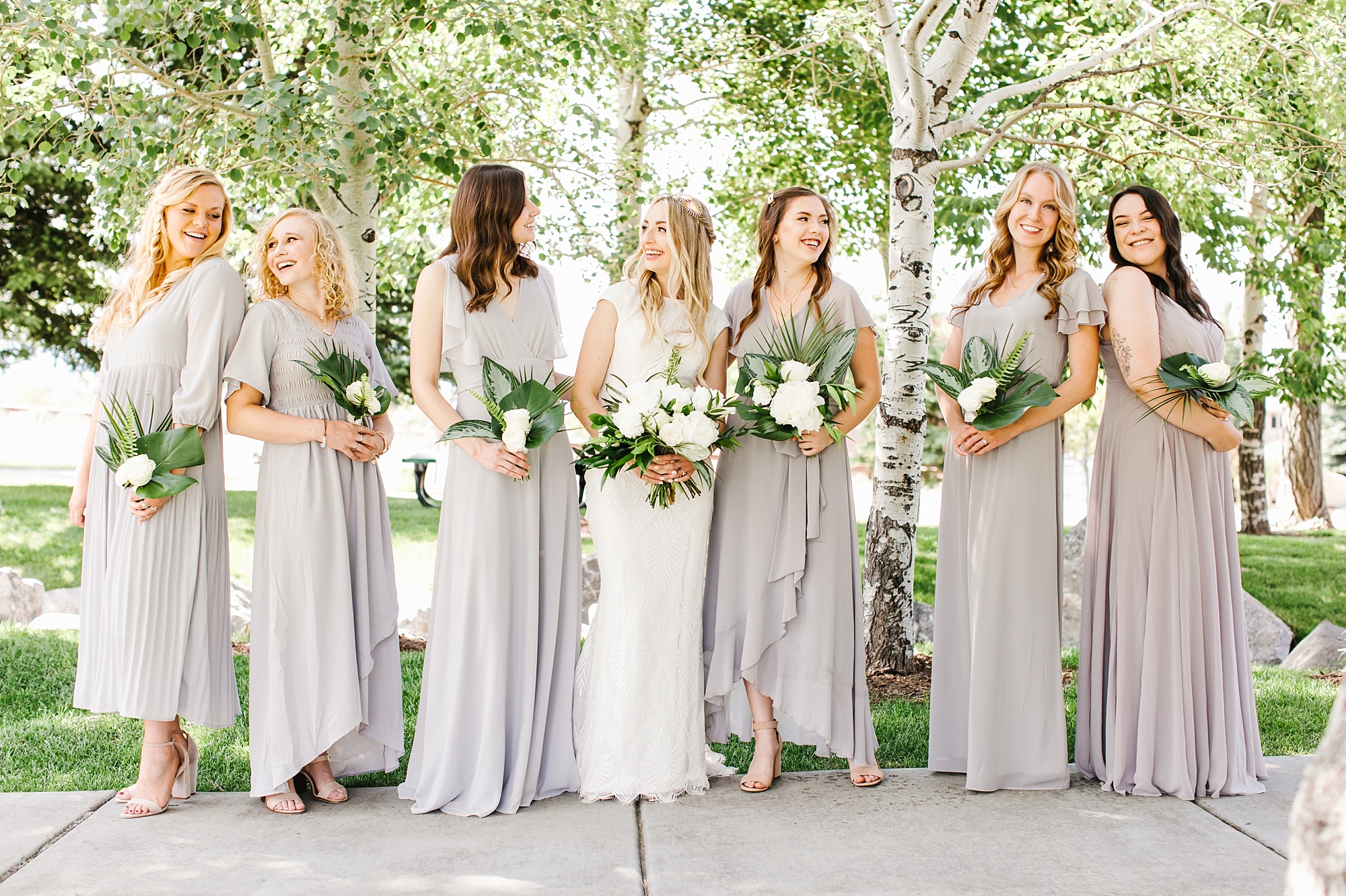 Dove Gray bridesmaids dresses and tropical bouquets