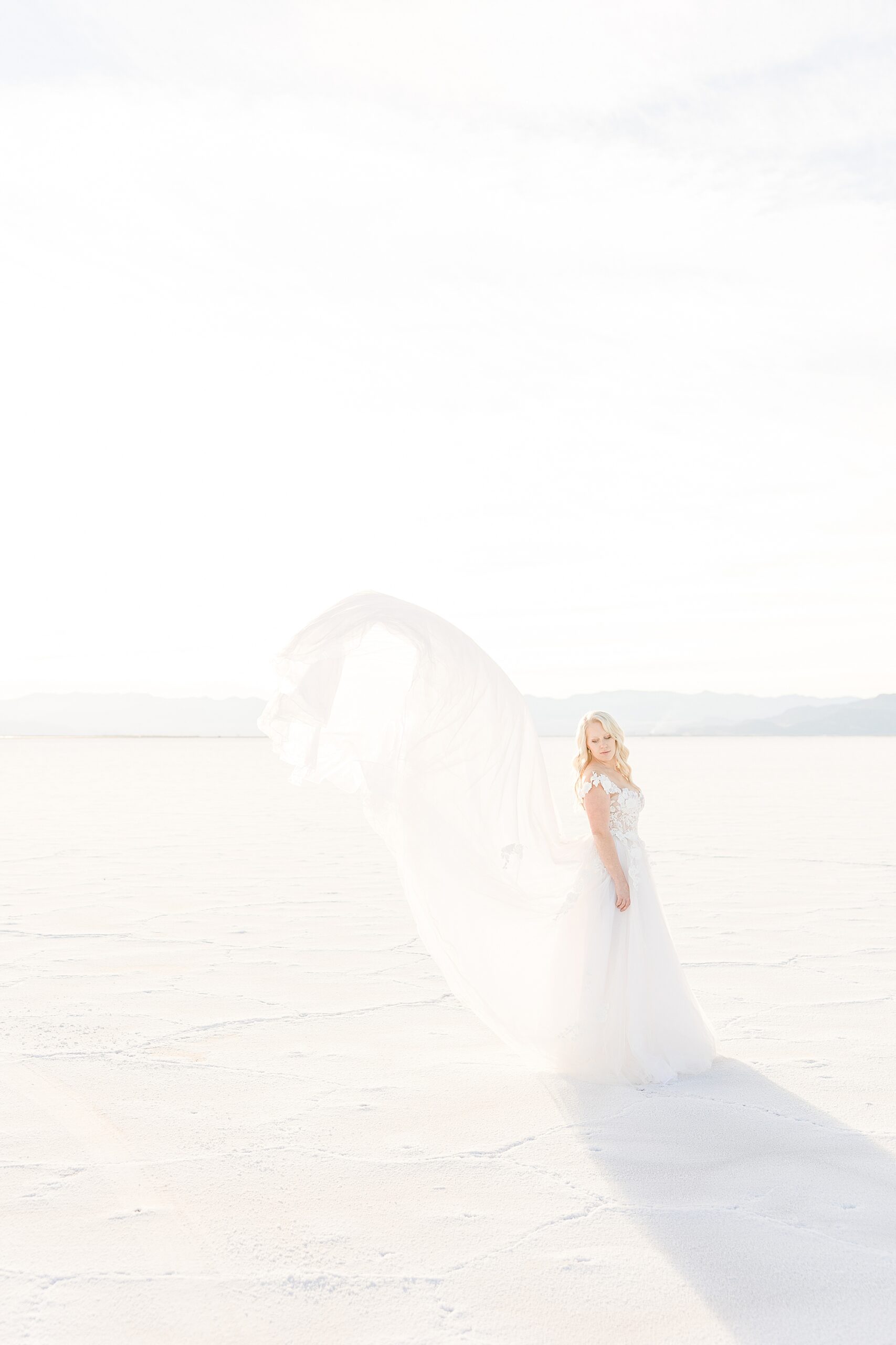 Bridal gown in the wind at the Bonneville Salt Flats