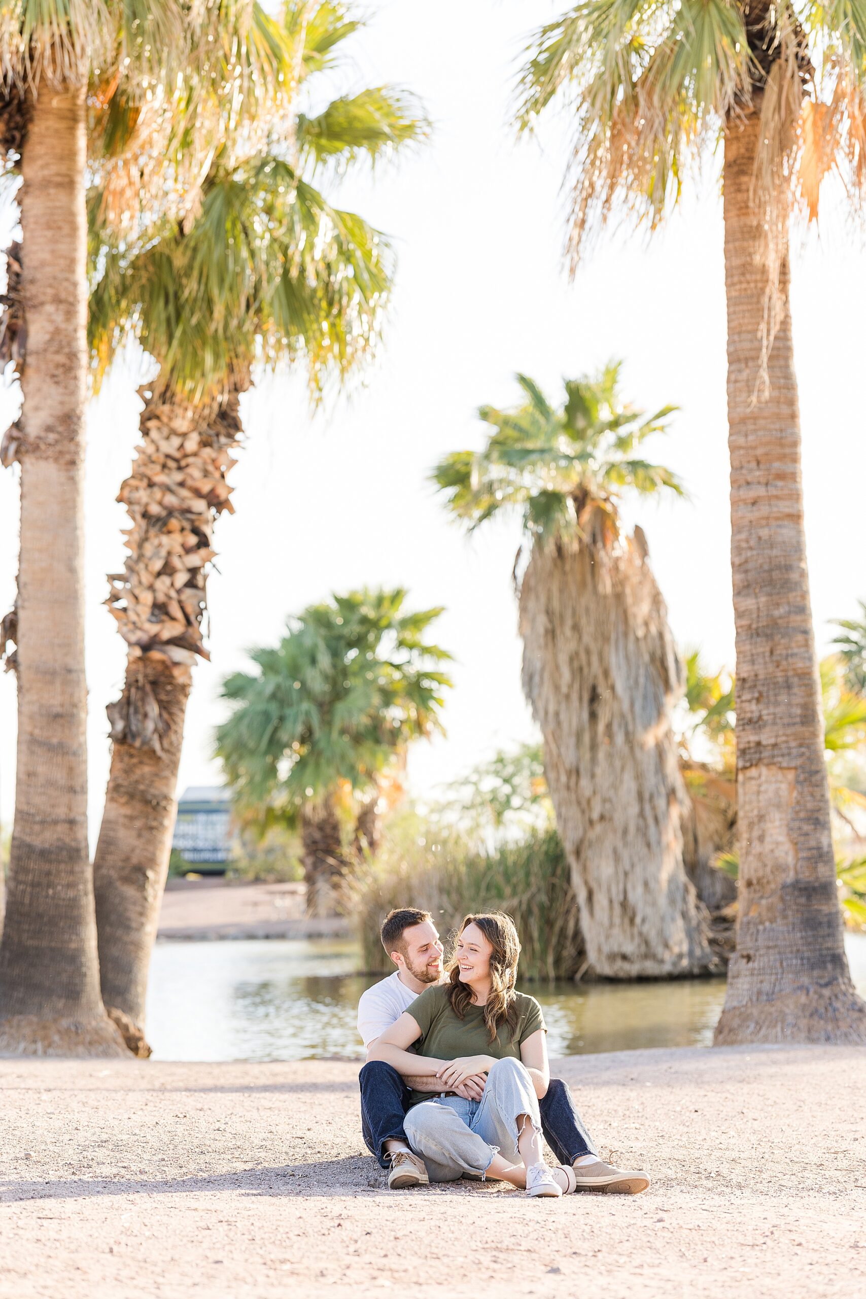 A candid shot of the couple talking and laughing during their engagement session at Papago Park
