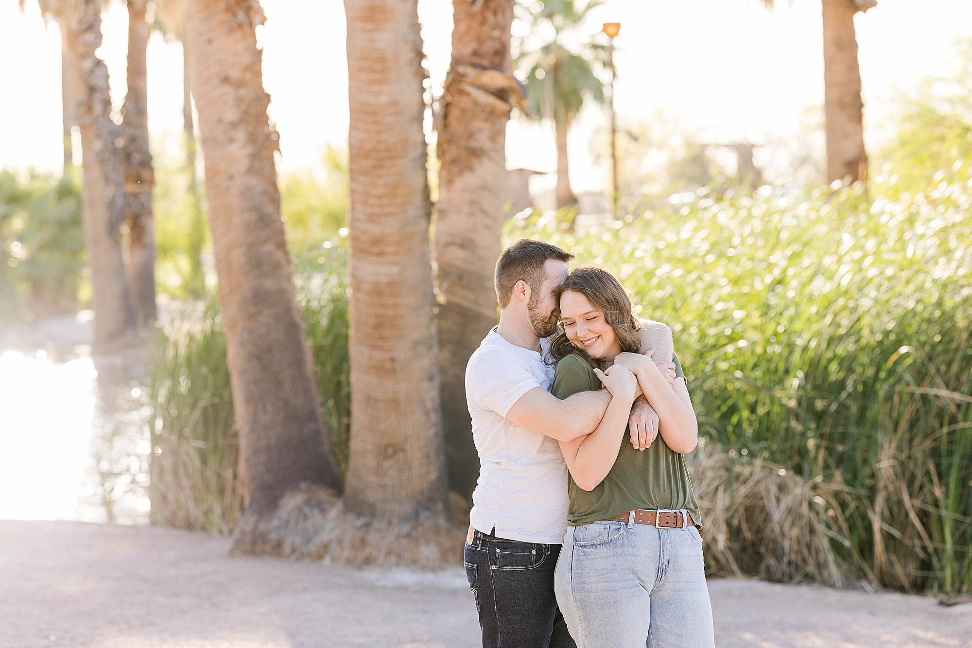 A candid shot of the couple laughing together during their engagement session at Papago Park

