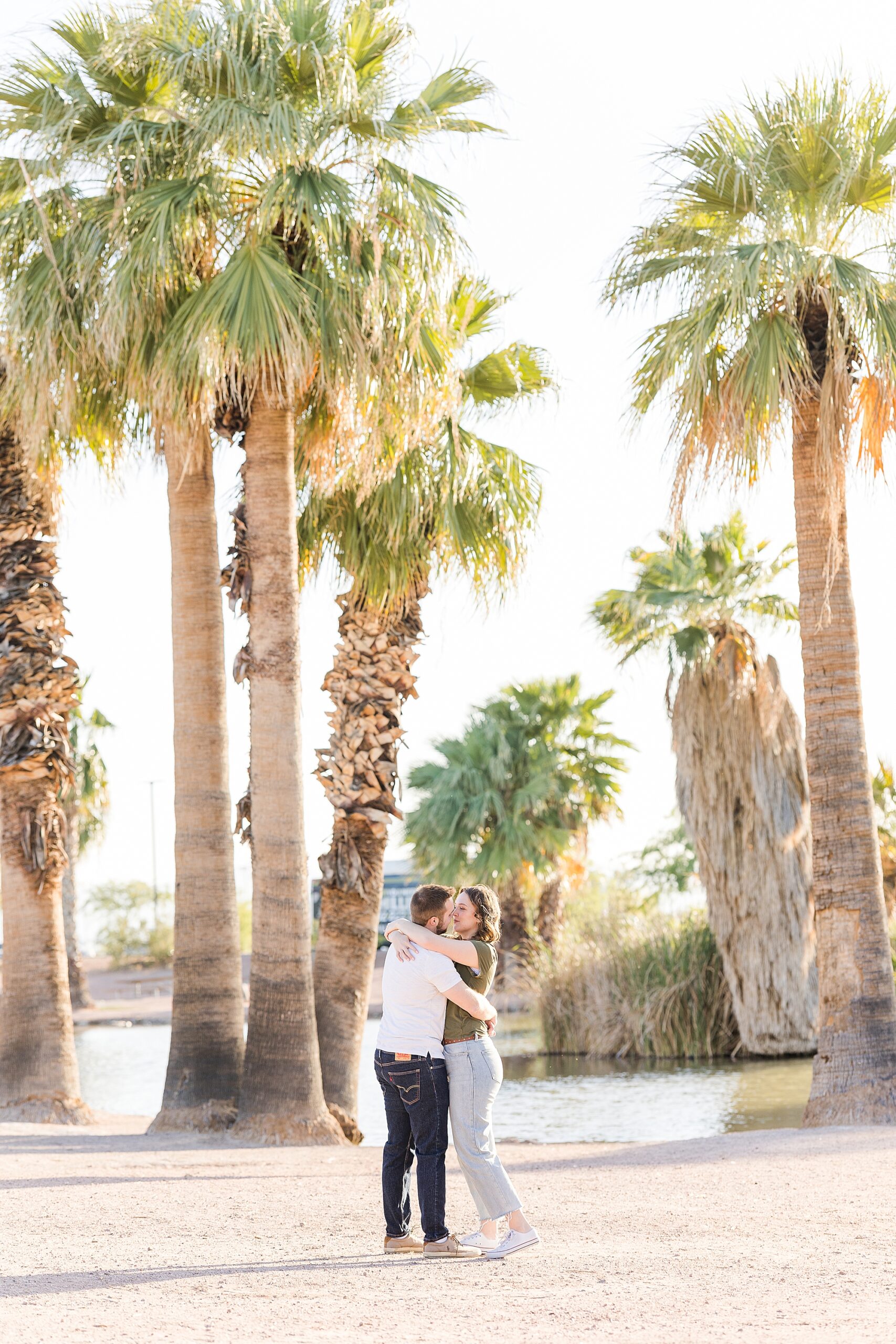 A romantic moment of the couple kissing at Papago Park during their engagement session
