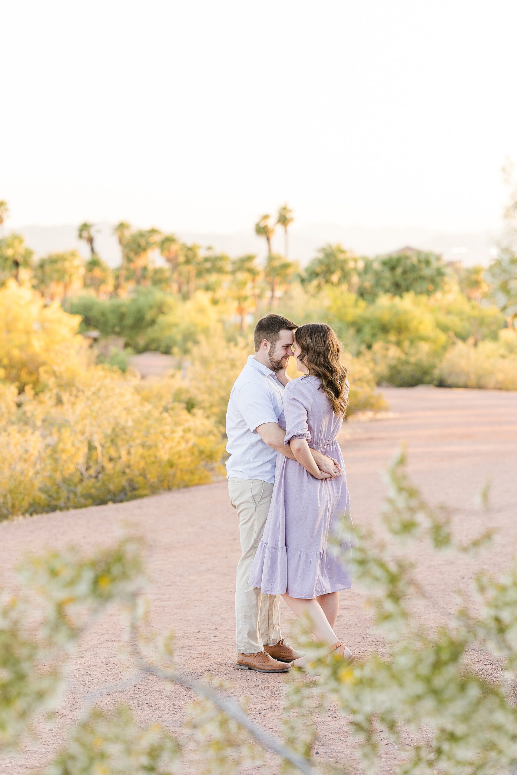 A shot of the couple holding each other tightly during their engagement session at Papago Park
