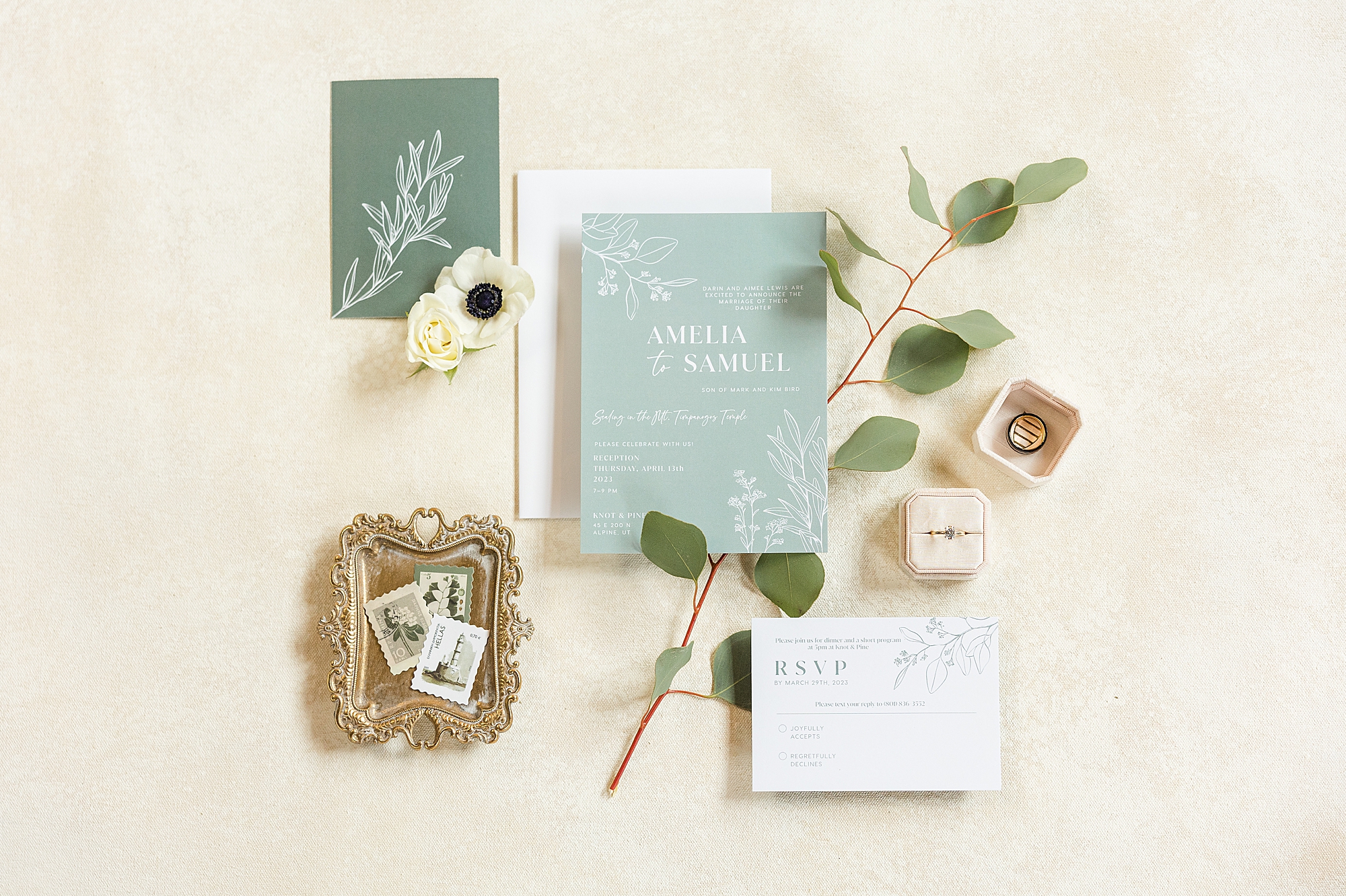 Elegant wedding invitation card with sage green and ivory accents

