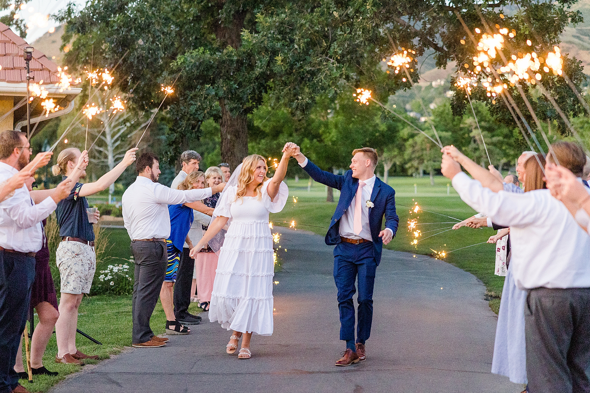 Newlyweds make a dazzling exit surrounded by a sea of sparkling sparklers.