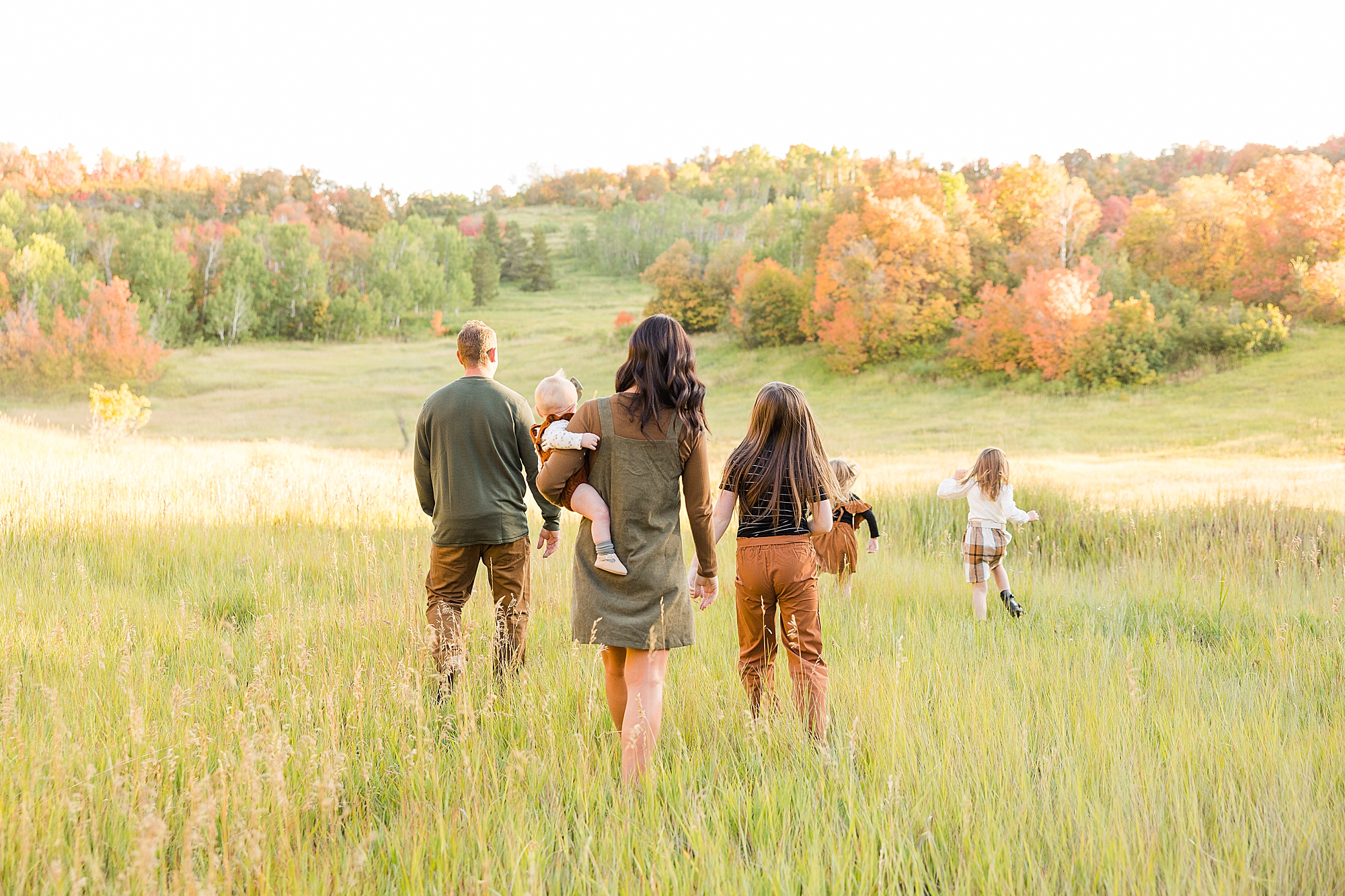 A large field full of vibrant fall colors. Perfect for your family session!