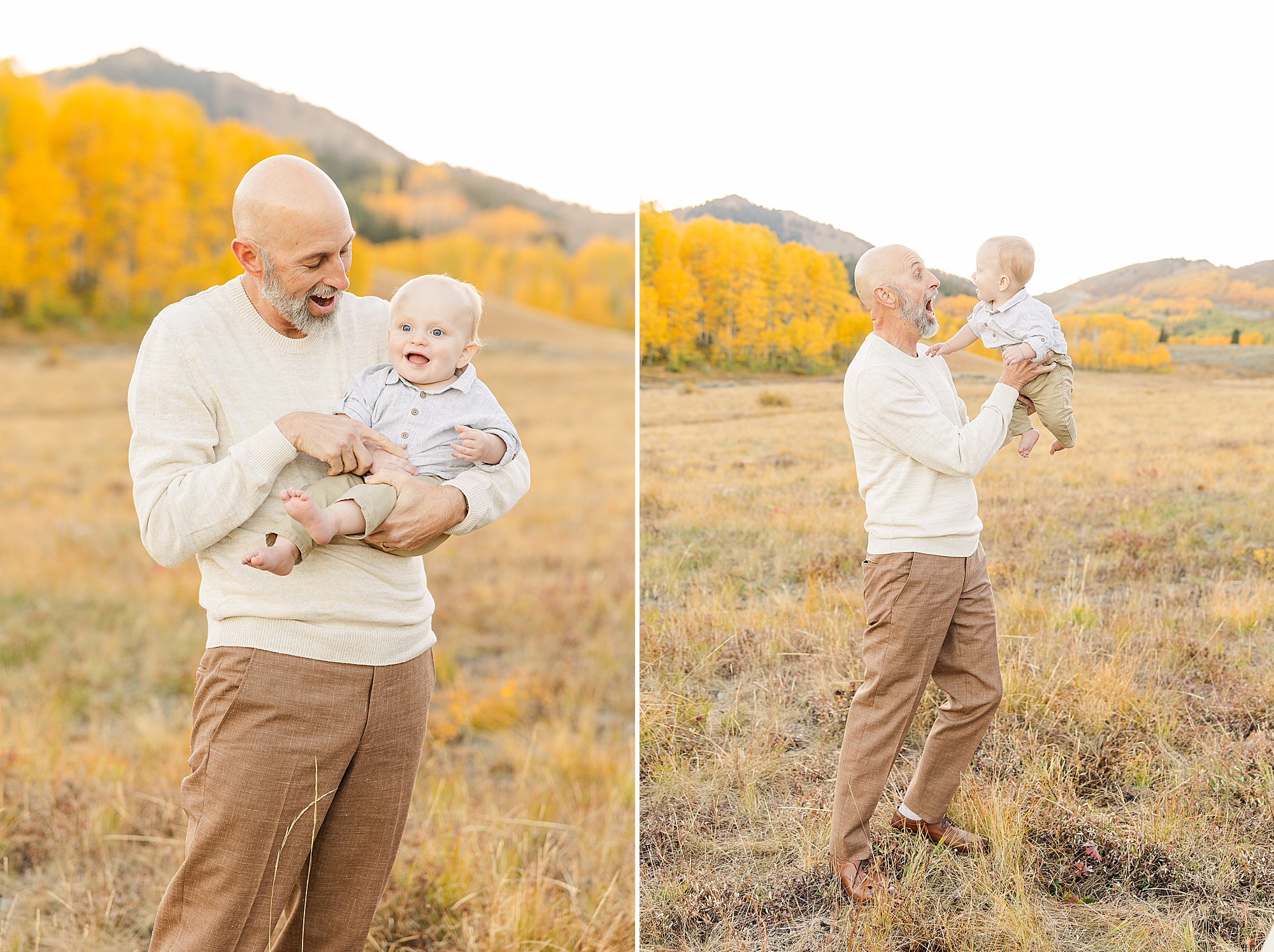 Loving dad holding his baby with mountains in the background.
